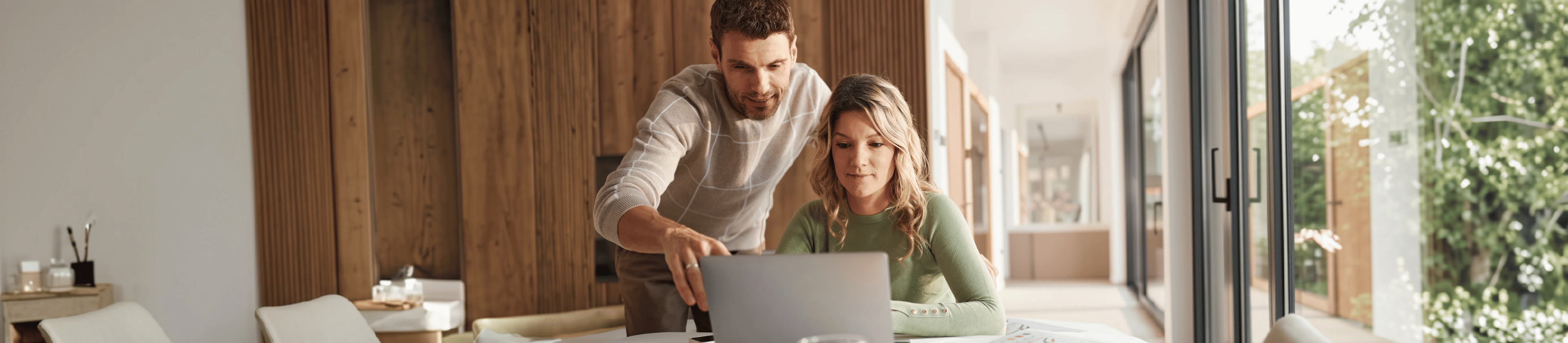 Young man and woman looking at laptop screen