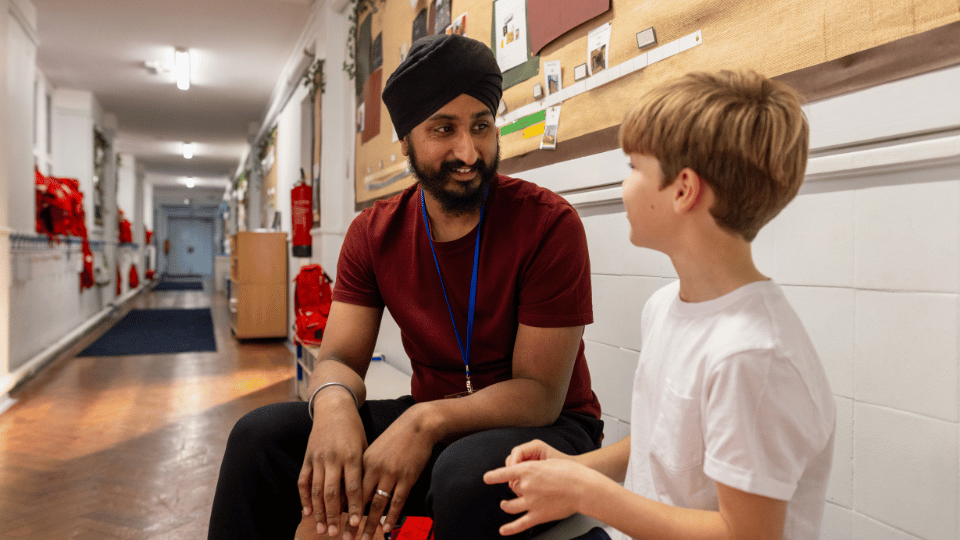Teacher Talking With Child